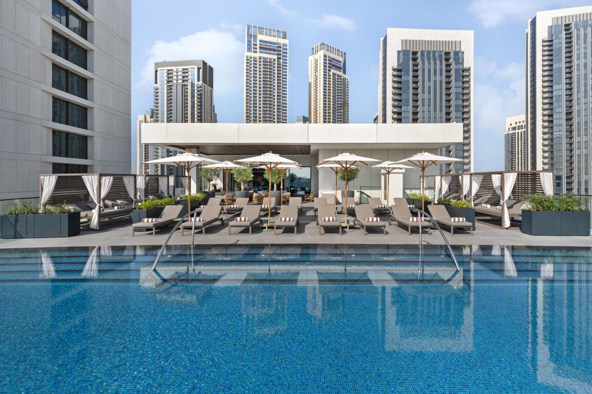 Palace Dubai Creek Harbour Extérieur photo The swimming pool at the hotel
